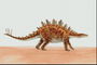 Кентрозавр ярко-оранжевого цвета, с шипами на хвосту