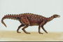 Динозавр темно-коричневого цвета с шипами серого цвета