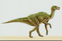 Динозавр с большими глазами и с ярко-слатовыми полосами