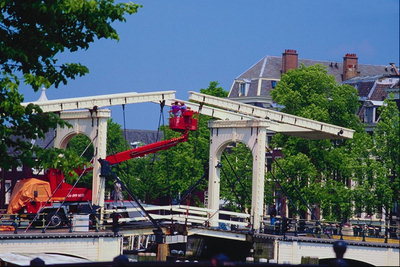 Construction of the bridge suspension bridge across the road