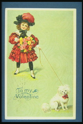 Une fille avec un chien. Félicitations à la rue Saint Valentin