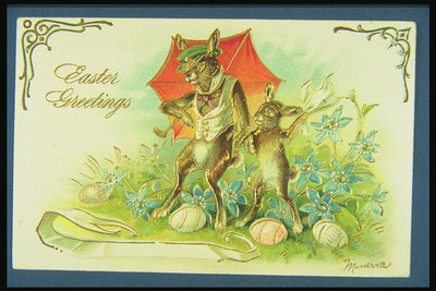 Postcard ilustrând iepuri sub umbrele