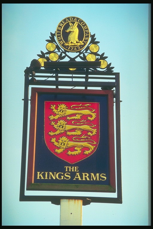 Sign board with an image of lions on a red background