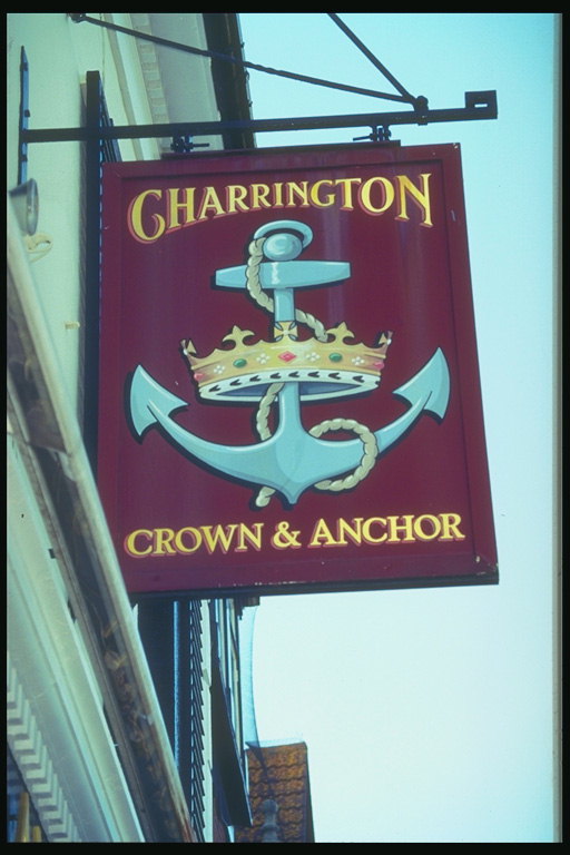 एक लंगर के चित्रण के साथ साइनबोर्ड लाल रंग, और शाही ताज
