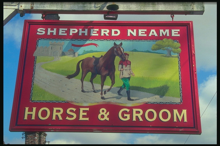 Signboard showing a horse and a young man walking on the trail