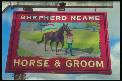 Skilt viser en hest og en ung mand gå på sporet