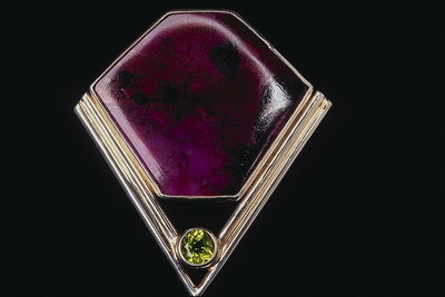 Brooch in the form of diamond with the heart of dark crimson tones