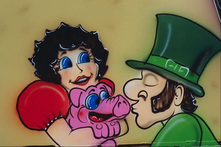 Comic karakter, një njeri në një kapelë dhe një grua me një derr