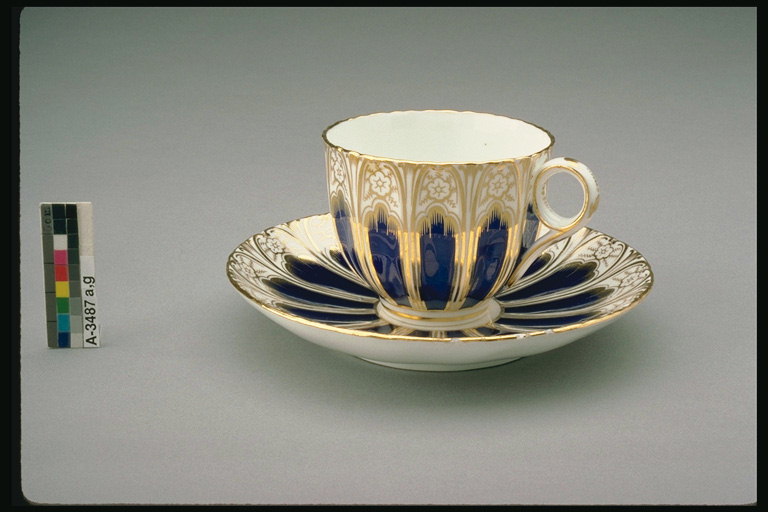 Chinese porcelain. Cup and saucer, gilt.
