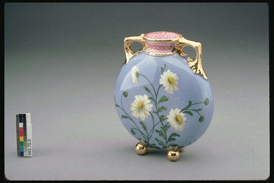 Vase with handles golden brown. White daisies on a blue background