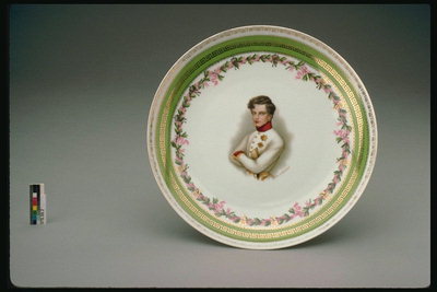 Plate with a portrait of a young man in the form