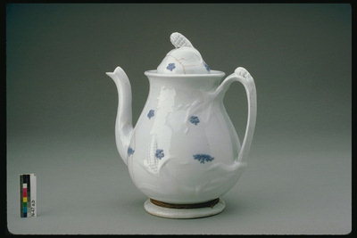 Teapot with a small blue pattern on the walls