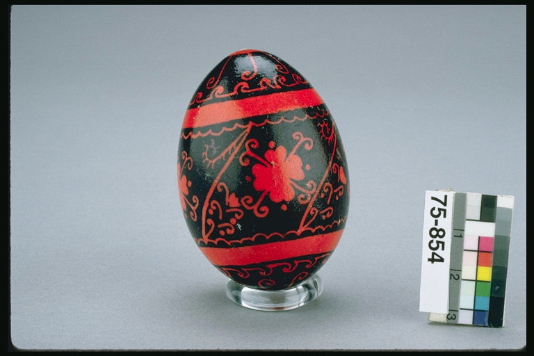 The red stripes and flowers in the egg, black