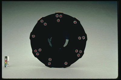 Saucer with black glass with drawings of small red flowers