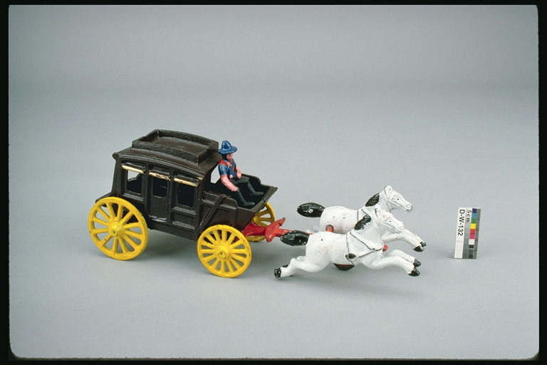 Children\'s toys. Lightweight coach and a pair of horses.