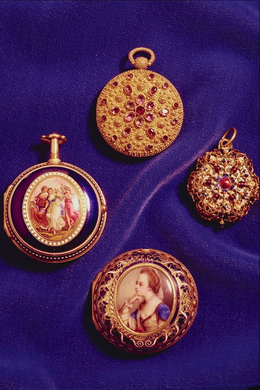 A collection of pocket watches. Portraits, precious stones decorate their shell