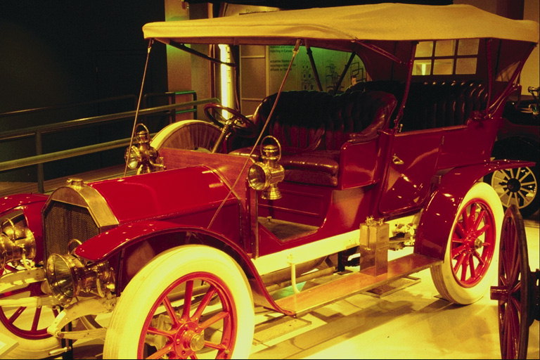 The car in red with white wheels
