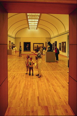 The long corridor of rooms with paintings