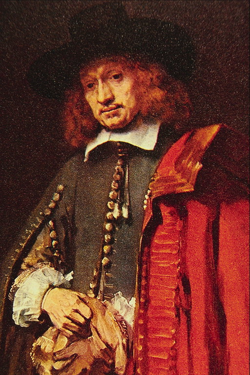 A man in a red cloak and gloves