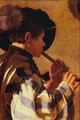 En ung man spelar ett pip