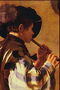 Un jeune homme joue un pipe