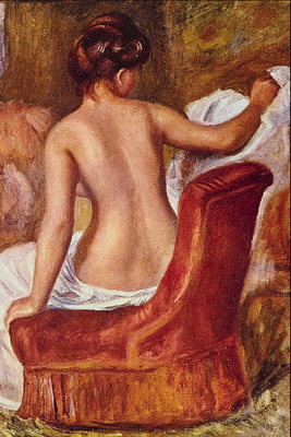 Girl with a naked back in a chair