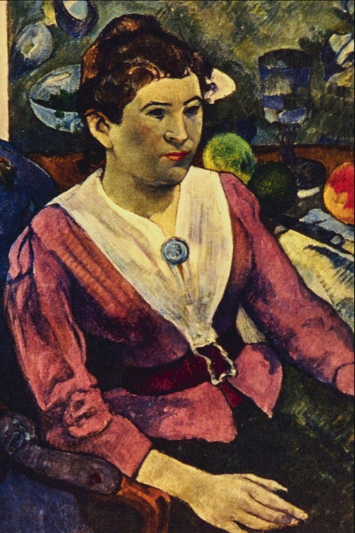 The woman in red jacket with a blue brooch