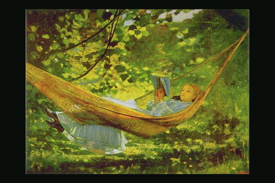 Girl with a book in a hammock