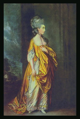 Moteris aukso suknelė