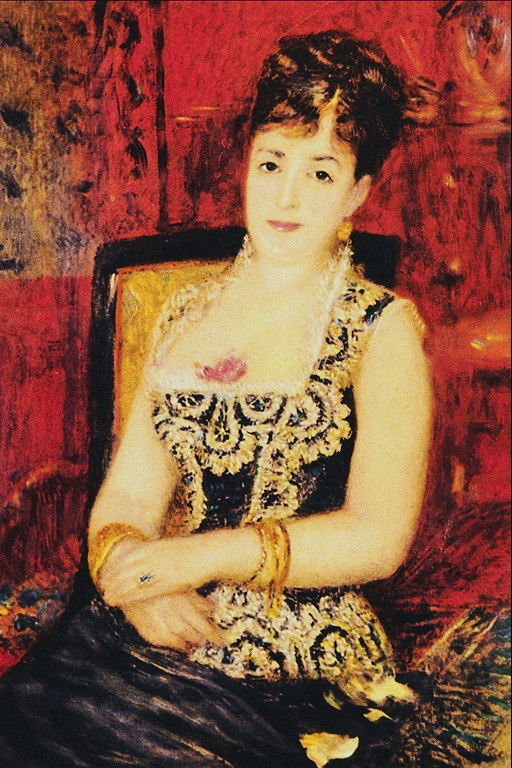 A woman in a dark dress with gold embroidery. Decoration with ruby