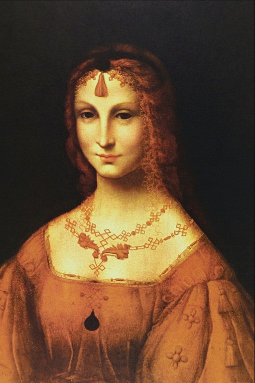 Donna in abito marrone con vishivkoy sulle maniche. Gioielli da marrone pietra. Sospensione e tiara