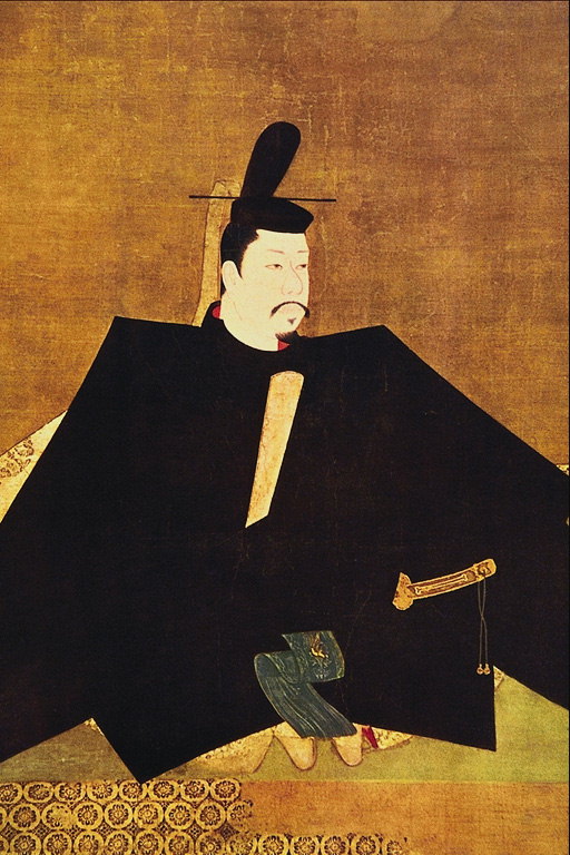 En mann i en sort kimono