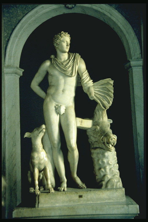 雕塑。 一名年轻男子与狗