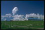 Белоснежные облака над фермой