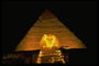 Сфинкс на фоне пирамиды Гизы
