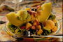 Долька дыни с манго, клубникой, зеленью салата