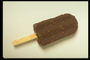Мороженое на палочке в шоколаде с орехами