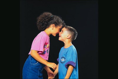 Boy and girl smiling to each other