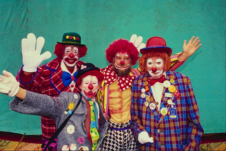 Clowns in bright costumes