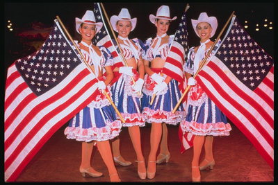 Girls in costumes symbolizing the flag of United States