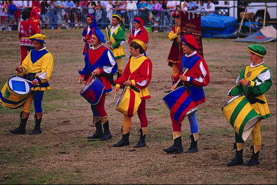 Men in colorful costumes and drums