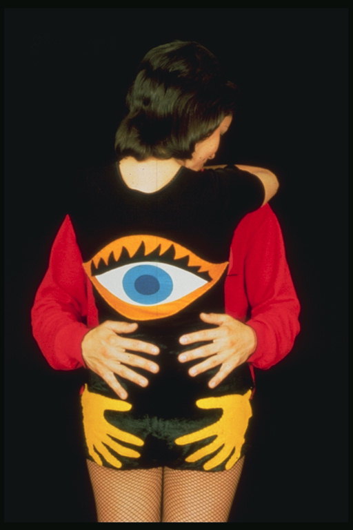 The dress with the image of the eyes and hands on the back