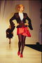 Red skirt with jagged edges. Jacket dark brown