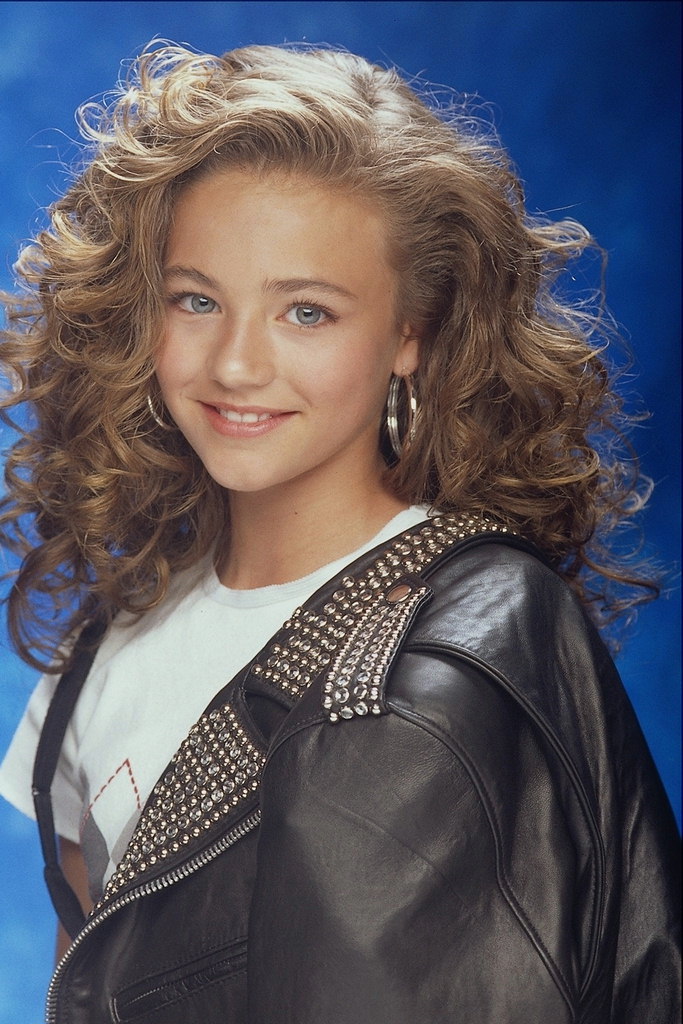 Girl in leather jacket with curly hair