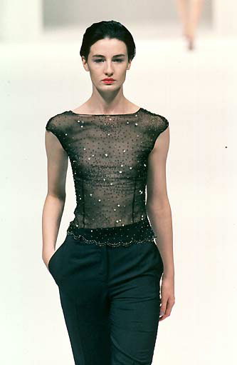 Pants and a transparent top with sequins