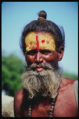 Elderly man with a pattern on the face