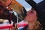 A girl kisses a horse
