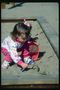 Девочка в песочнице
