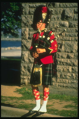 A musician with a bagpipe
