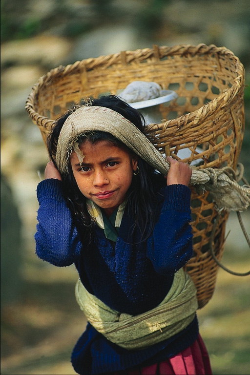 Girl with baskets on their shoulders